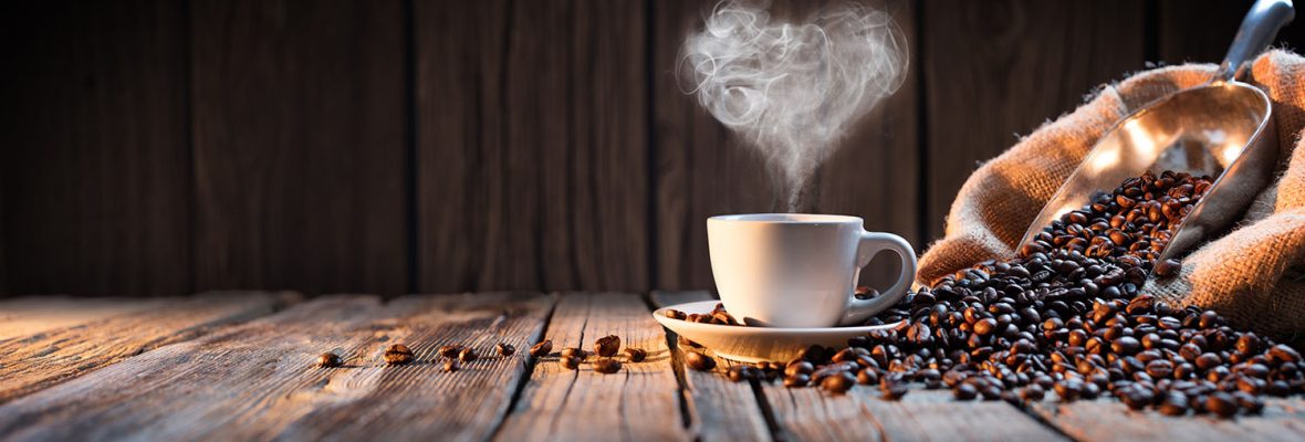 Traditional Coffee Cup With Heart-Shaped Steam On Rustic Wood